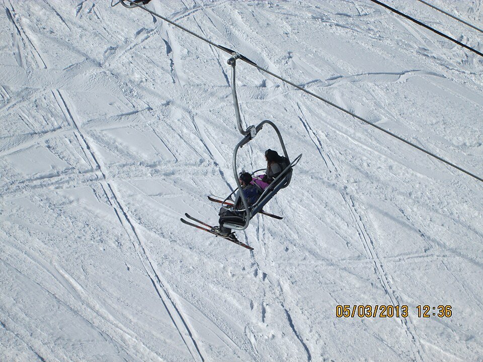Skiers descending Gulmarg's beginner slopes